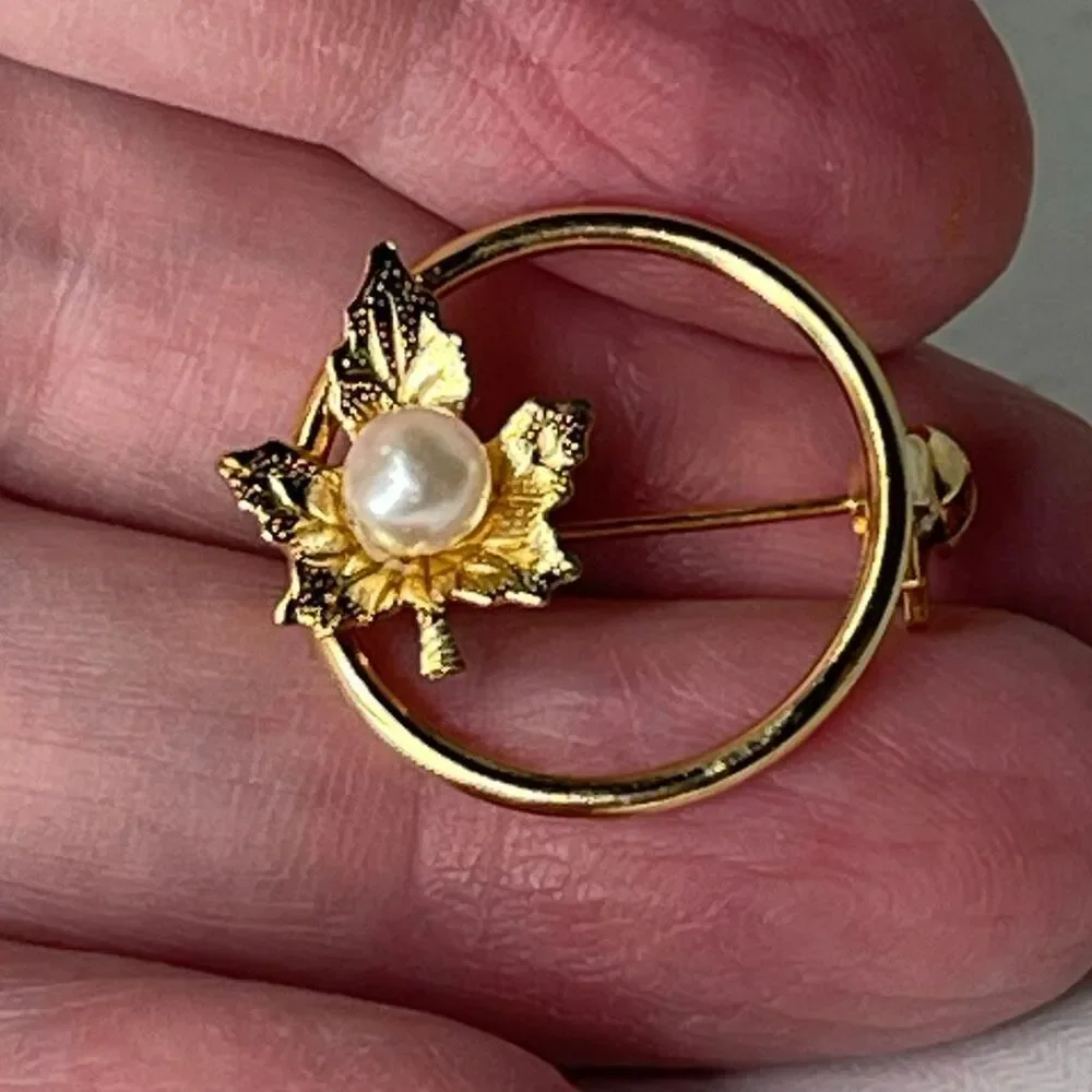 Vintage pearl adorned maple leaf open circle brooch.